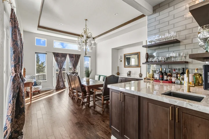 Light kitchen with an island and adjacent bay-window dining area